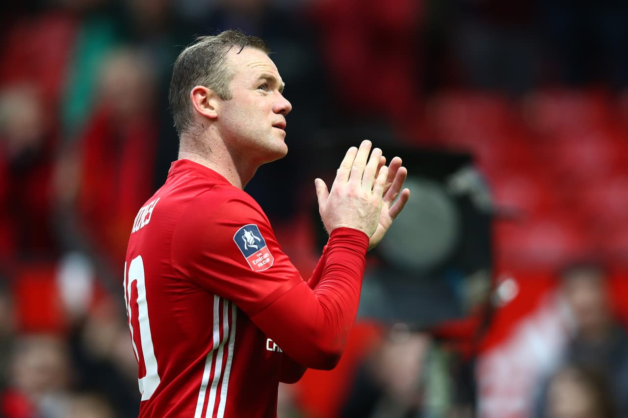 MANCHESTER, ENGLAND - JANUARY 07: Wayne Rooney of Manchester United applauds supporters following victory in the Emirates FA Cup third round match between Manchester United and Reading at Old Trafford on January 7, 2017 in Manchester, England. (Photo by Clive Brunskill/Getty Images)