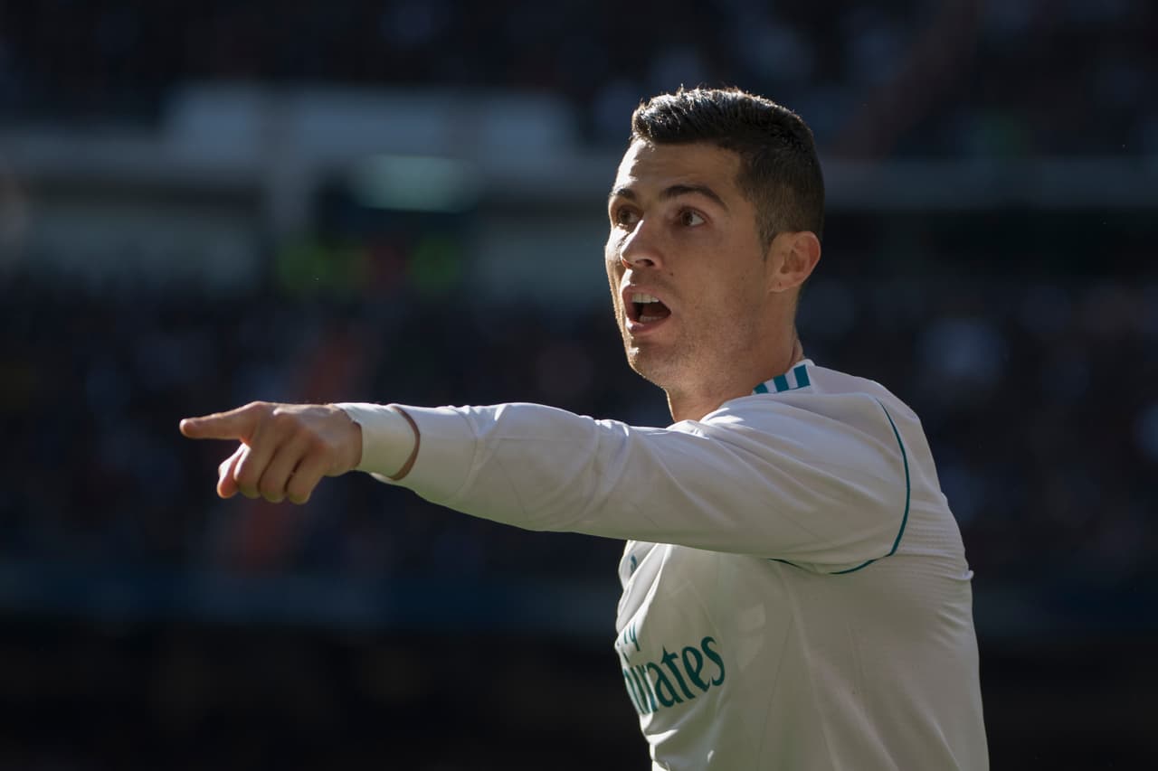 Real Madrid's Portuguese forward Cristiano Ronaldo gestures during the Spanish League "Clasico" football match Real Madrid CF vs FC Barcelona at the Santiago Bernabeu stadium in Madrid on December 23, 2017. / AFP PHOTO / CURTO DE LA TORRE (Photo credit should read CURTO DE LA TORRE/AFP/Getty Images)