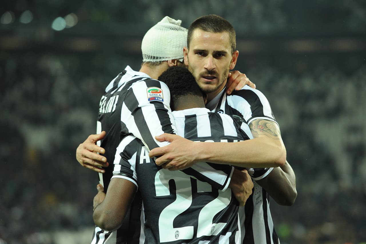 TURIN, ITALY - MARCH 26: Giorgio Chiellini (L), Kwadwo Asamoah and Leonardo Bonucci of Juventus celebrate victory at the end of the serie A match between Juventus and Parma FC at Juventus Arena on March 26, 2014 in Turin, Italy. (Photo by Valerio Pennicino/Getty Images)