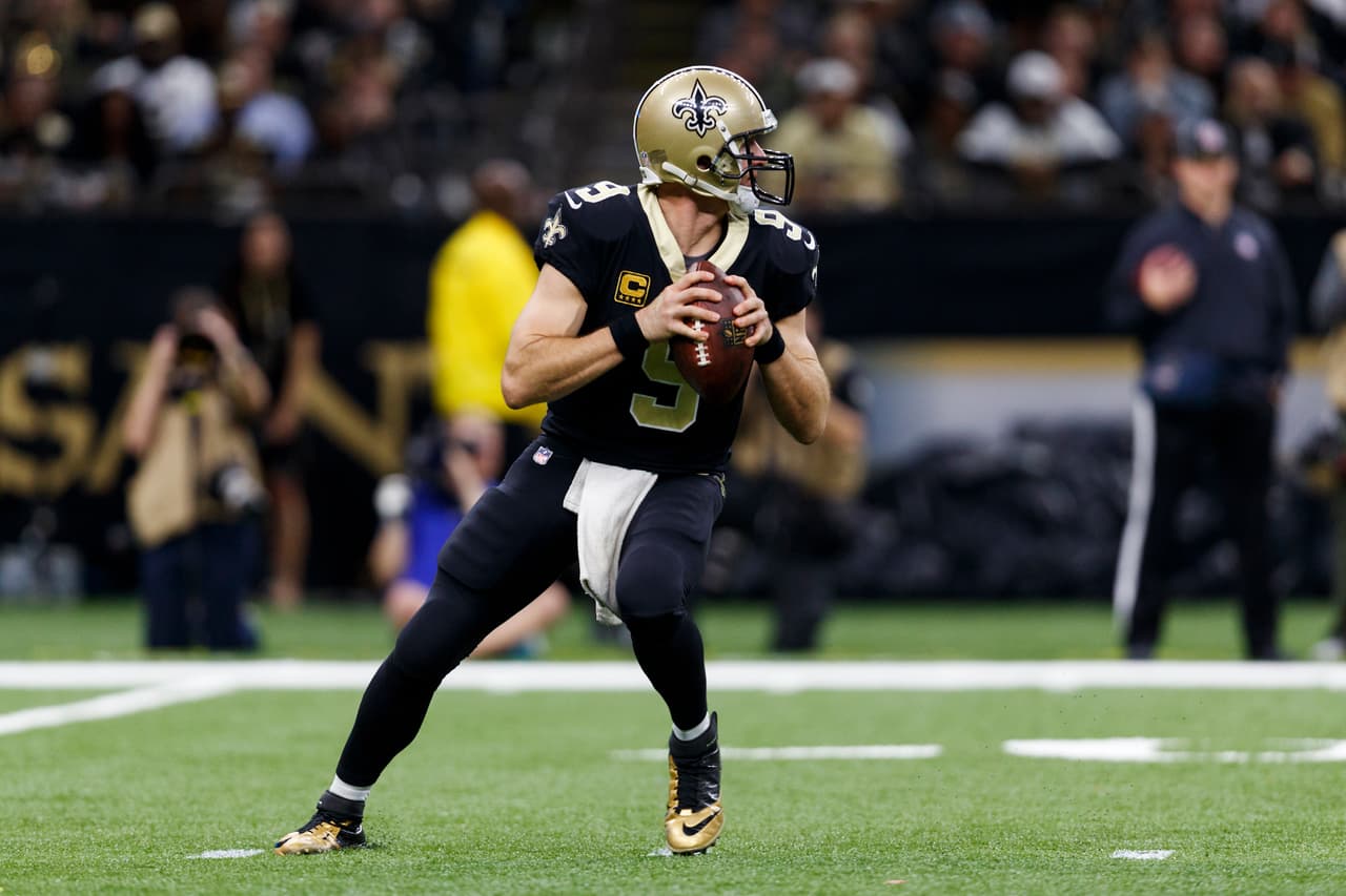 New Orleans Saints quarterback Drew Brees (9) looks to pass during an NFL football NFC wild card playoff game against the Carolina Panthers, Sunday, Jan. 7, 2018, in New Orleans. The Saints defeated the Panthers, 31-26. (Ryan Kang via AP)