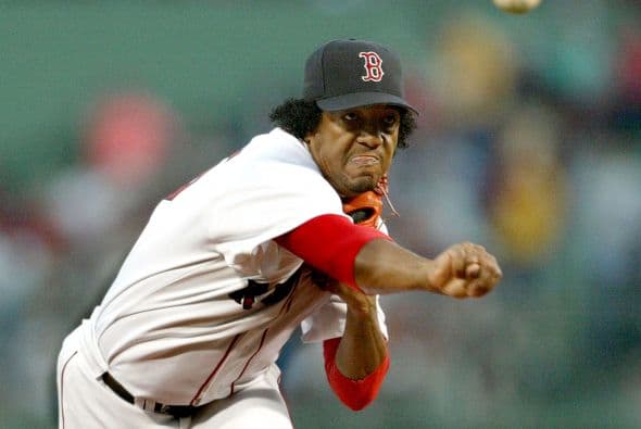 Martínez fue cambiado a los Medias Rojas de Boston en noviembre de 1997 por Carl Pavano y Tony Armas, Jr., y fue firmado para un período de seis años, con un contrato de $75,000,000, siendo el más grande jamás otorgado a un lanzador en ese momento.
