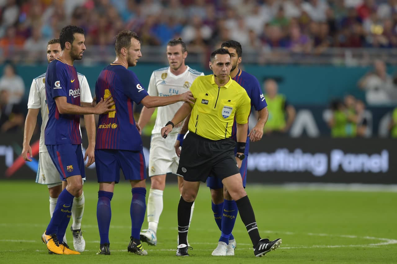 Ivan Rakitic (center-left) of Barcelona reacts during their International Champions Cup football match at Hard Rock Stadium on July 29, 2017 in Miami, Florida. Barcelona won 3-2. / AFP PHOTO / HECTOR RETAMAL (Photo credit should read HECTOR RETAMAL/AFP/Getty Images)