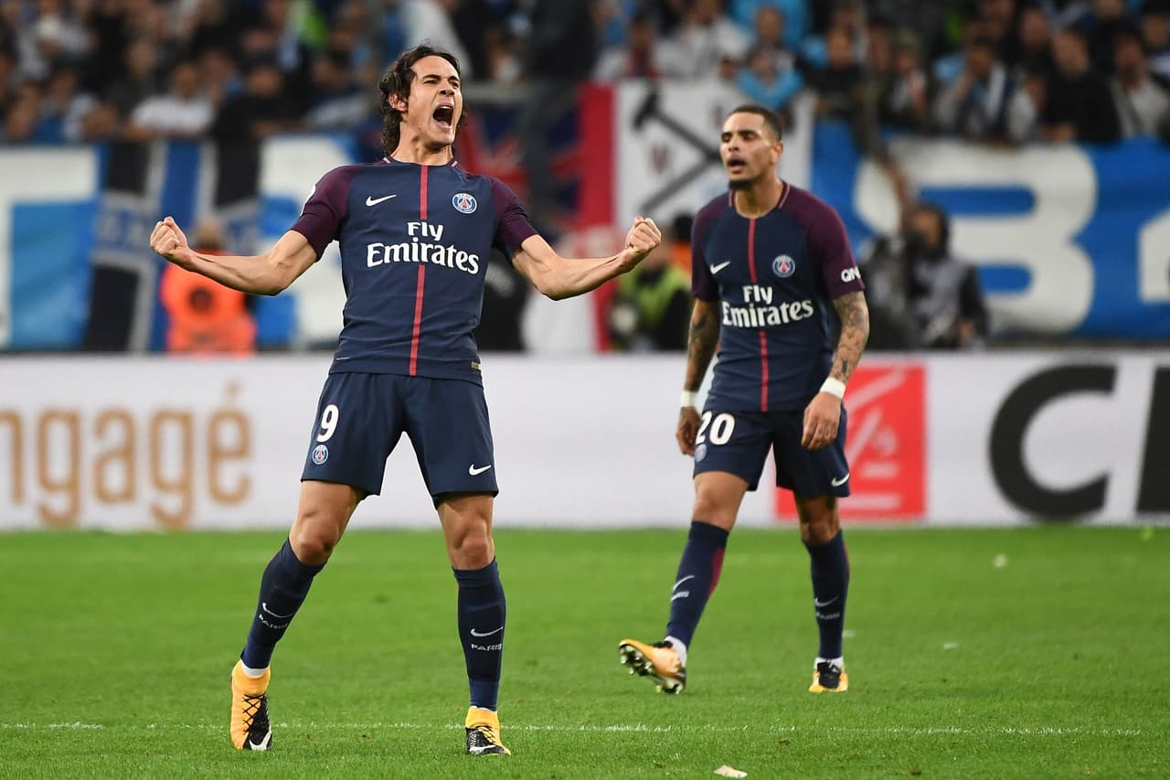 Paris Saint-Germain's Uruguayan forward Edinson Cavani (L) celebrates after scoring a goal during the French L1 football match between Marseille (OM) and Paris Saint-Germain (PSG) on October 22, 2017, at the Velodrome Stadium in Marseille, southeastern France. / AFP PHOTO / BORIS HORVAT (Photo credit should read BORIS HORVAT/AFP/Getty Images)