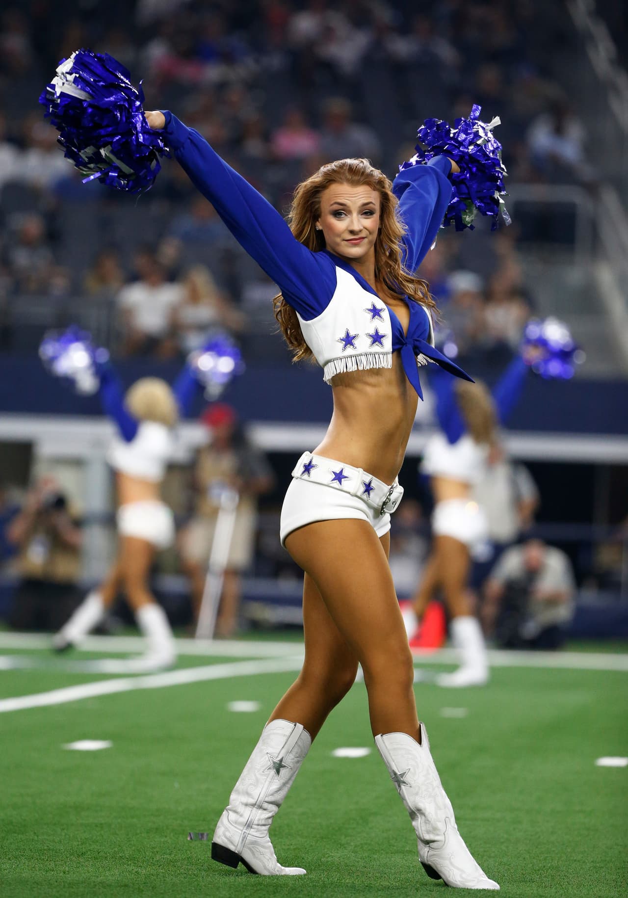 Dallas Cowboys cheerleaders perform during the second half of a preseason NFL football game against the Arizona Cardinals in Arlington, Texas, Sunday, Aug. 26, 2018. (AP Photo/Michael Ainsworth)