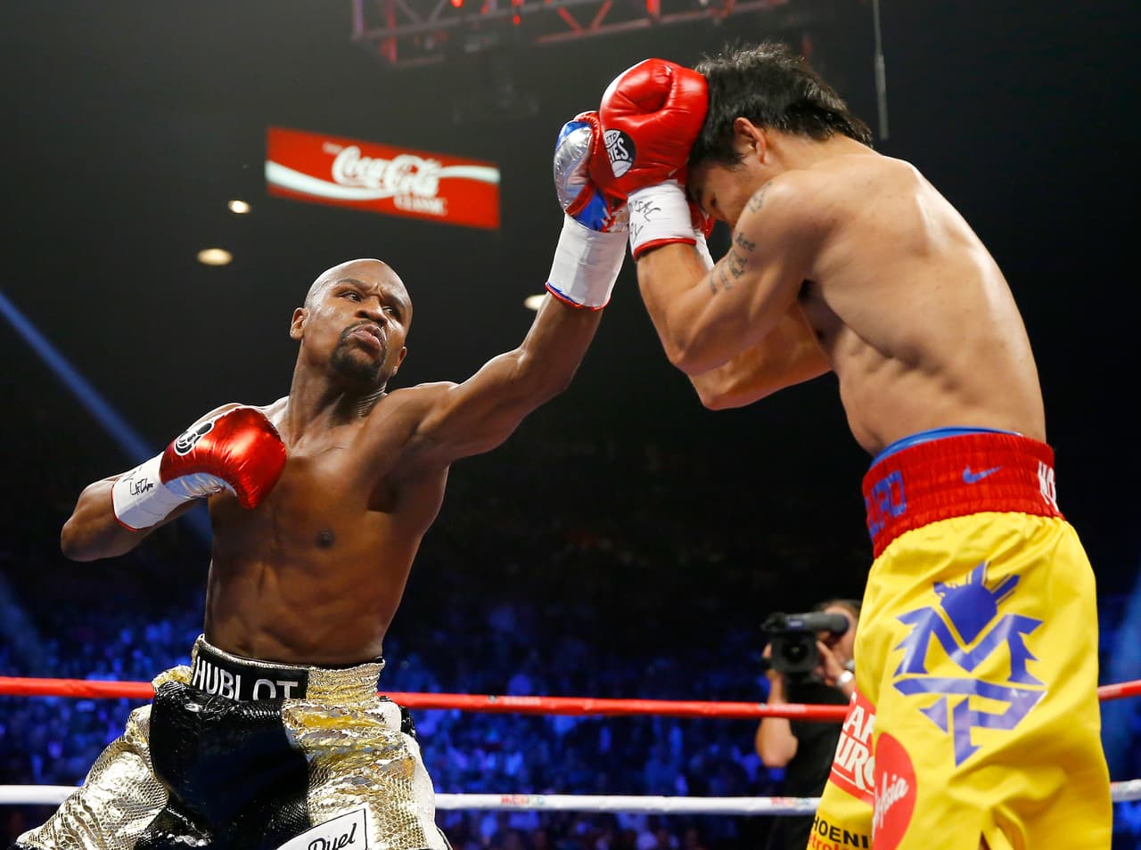 LAS VEGAS, NV - MAY 02: Floyd Mayweather Jr. throws a left at Manny Pacquiao during their welterweight unification championship bout on May 2, 2015 at MGM Grand Garden Arena in Las Vegas, Nevada. (Photo by Al Bello/Getty Images)