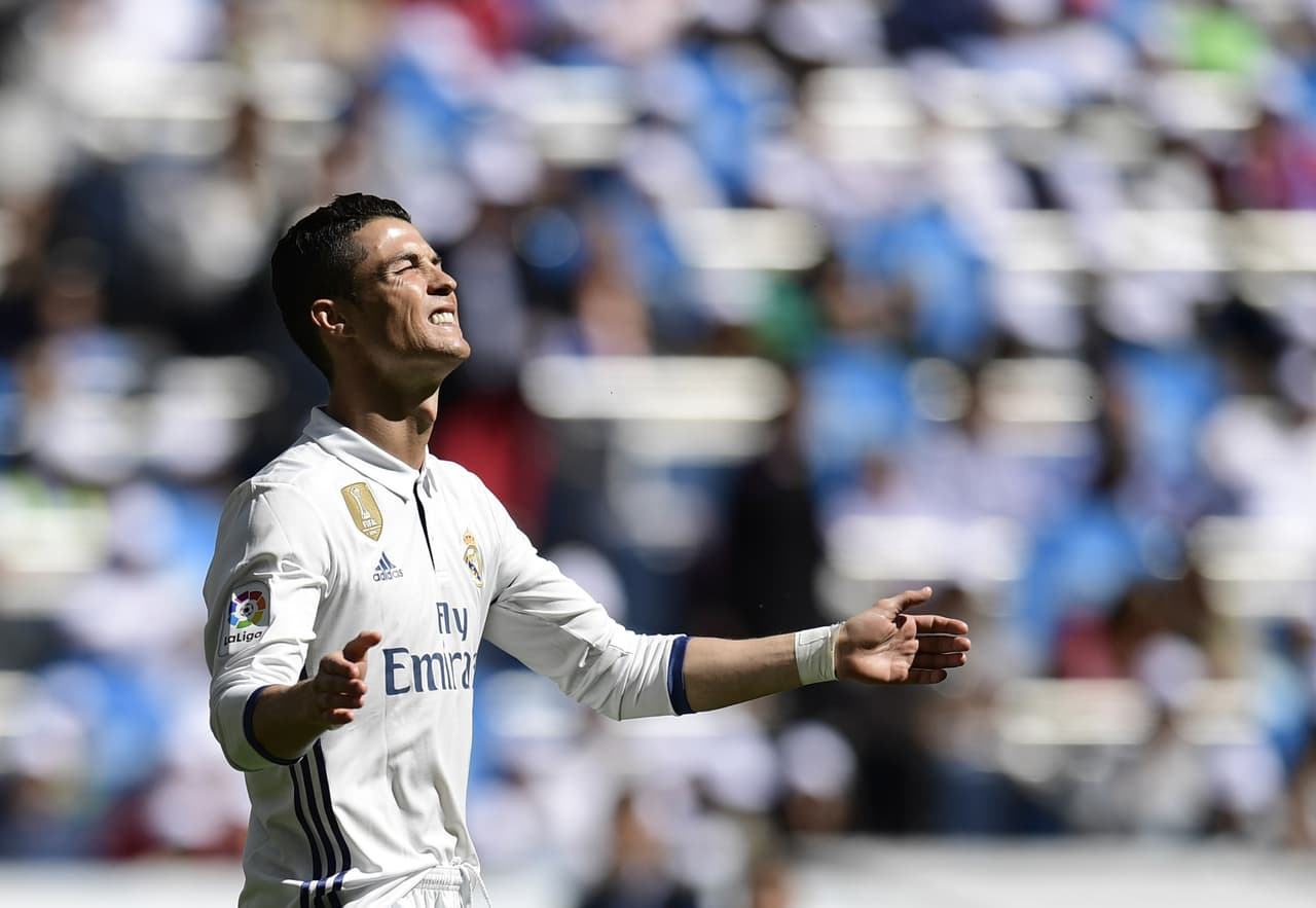 Real Madrid's Portuguese forward Cristiano Ronaldo gestures during the Spanish league football match Real Madrid CF vs Deportivo Alaves at the Santiago Bernabeu stadium in Madrid on April 2, 2017. / AFP PHOTO / JAVIER SORIANO (Photo credit should read JAVIER SORIANO/AFP/Getty Images)