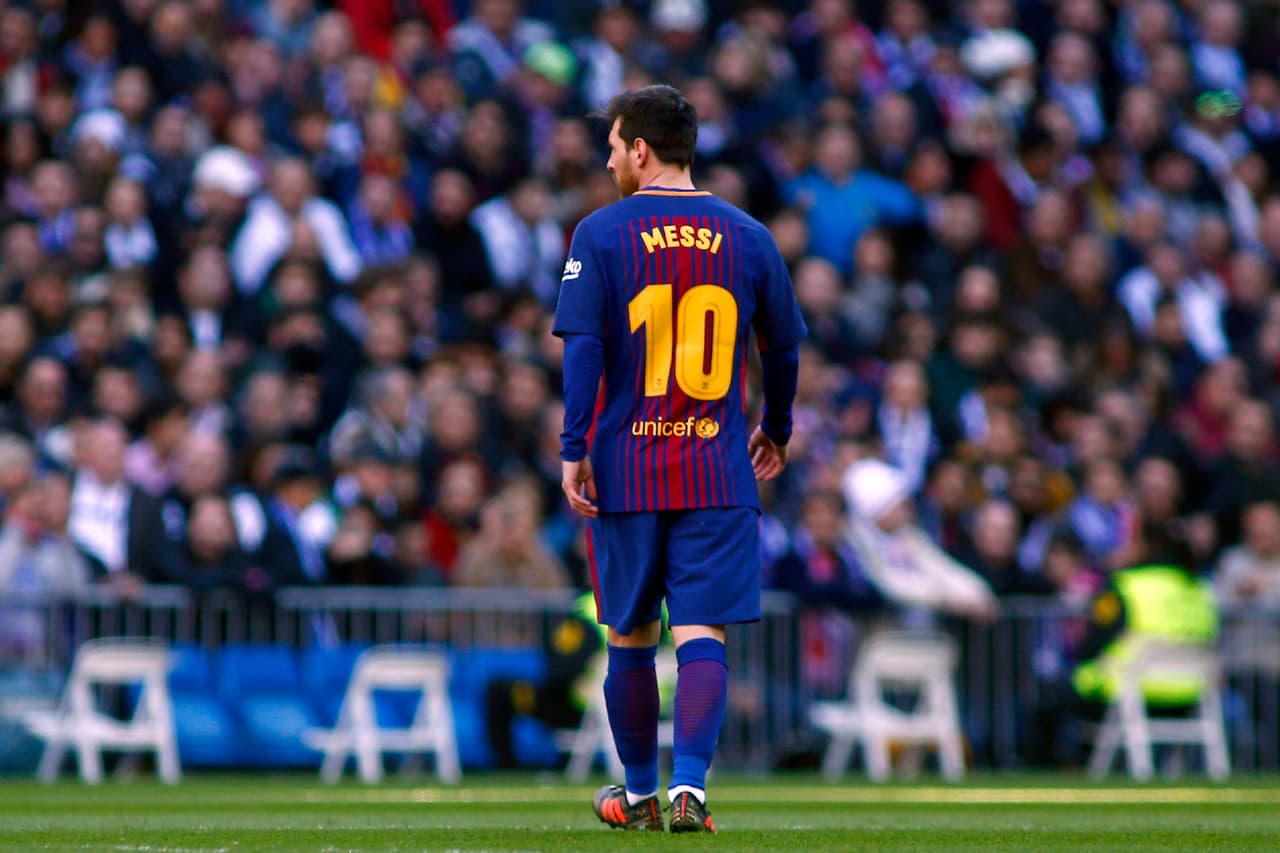 Barcelona's Argentinian forward Lionel Messi looks on during the Spanish League "Clasico" football match Real Madrid CF vs FC Barcelona at the Santiago Bernabeu stadium in Madrid on December 23, 2017. / AFP PHOTO / OSCAR DEL POZO (Photo credit should read OSCAR DEL POZO/AFP/Getty Images)