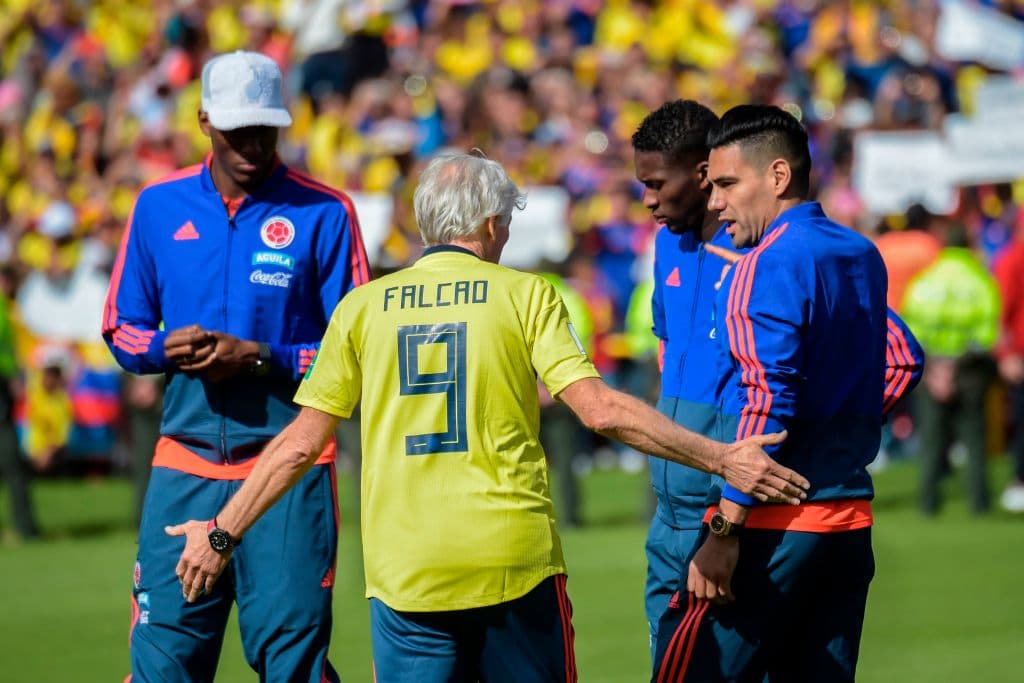 Colombia's national football team coach, Argentinian Jose Pekerman (C) speaks with players Radamel Falcao (R) and Yerry Mina (2-R) during their welcoming ceremony at El Campin stadium in Bogota on July 5, 2018, after their participation in the FIFA World Cup. - England beat Colombia in a dramatic penalty shootout in Moscow on July 3 to reach the World Cup quarter-finals. (Photo by Raul ARBOLEDA / AFP) (Photo credit should read RAUL ARBOLEDA/AFP/Getty Images)