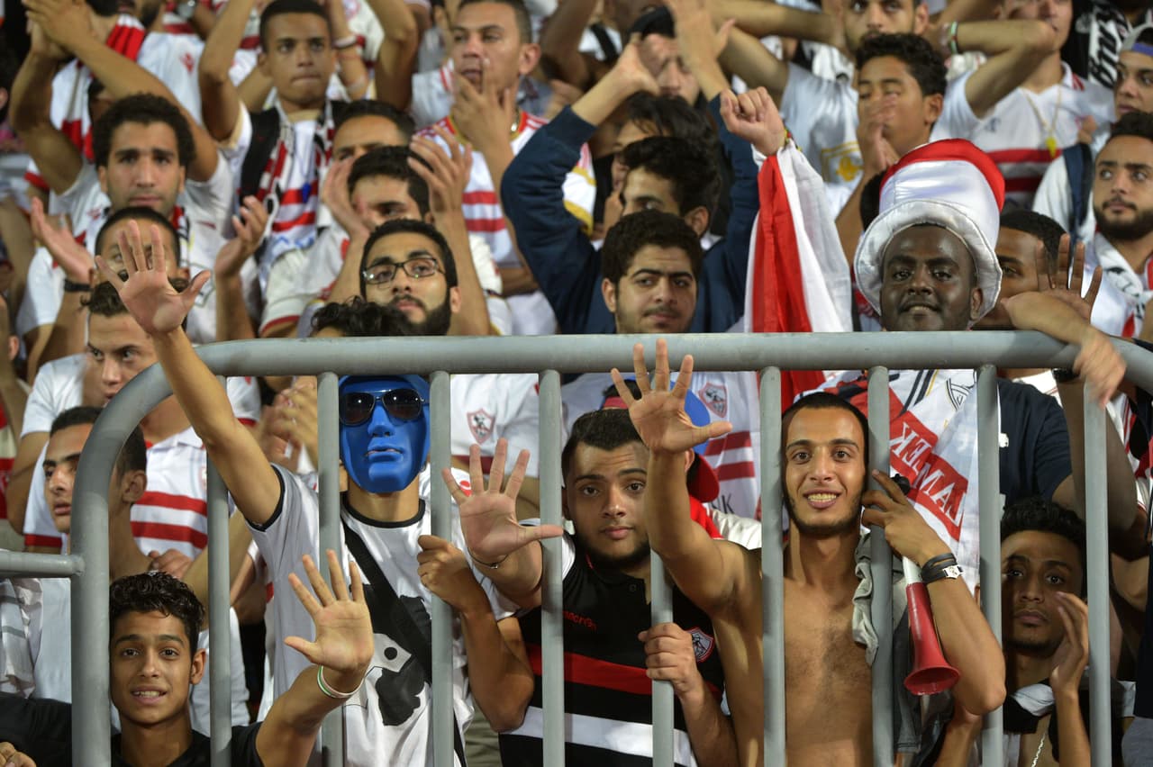 Egypt's Zamalek football club fans cheer prior to the start of the CAF Champions League final match between Egypts Zamalek club and South Africas Mamelodi Sundowns on October 23, 2016 at the Borg el-Arab Stadium, near Alexandria. / AFP / STRINGER (Photo credit should read STRINGER/AFP/Getty Images)