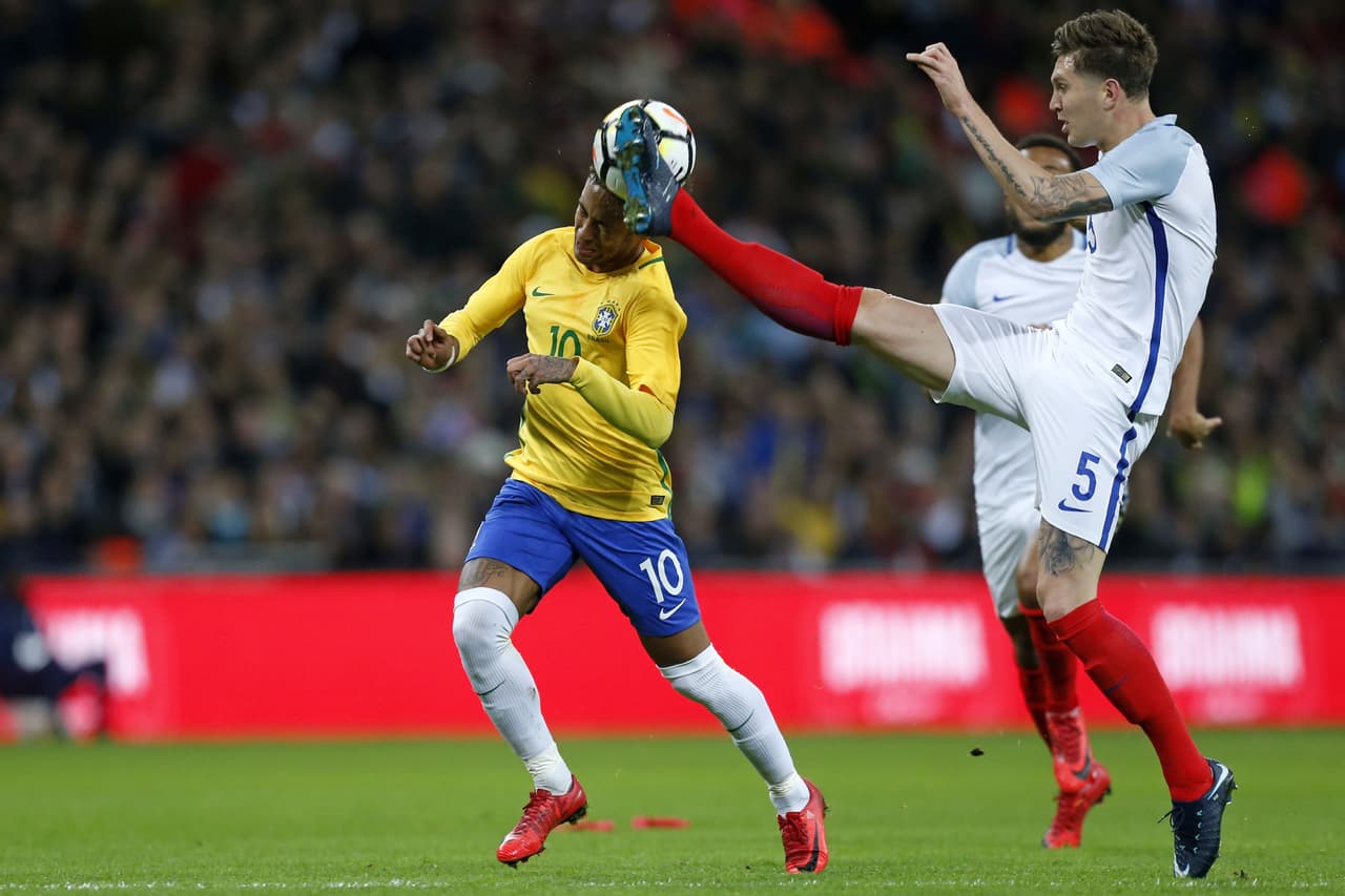 England's defender John Stones (R) vies with Brazil's striker Neymar during the international friendly football match between England and Brazil at Wembley Stadium in London on November 14, 2017. / AFP PHOTO / Ian KINGTON / NOT FOR MARKETING OR ADVERTISING USE / RESTRICTED TO EDITORIAL USE (Photo credit should read IAN KINGTON/AFP/Getty Images)