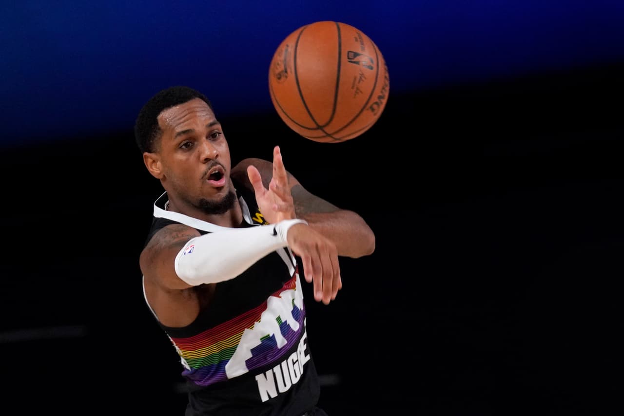 Denver Nuggets' Monte Morris (11) makes a pass during the second half an NBA first round playoff basketball game against the Utah Jazz on Tuesday, Sept. 1,2020, in Lake Buena Vista, Fla. (AP Photo/Mark J. Terrill)