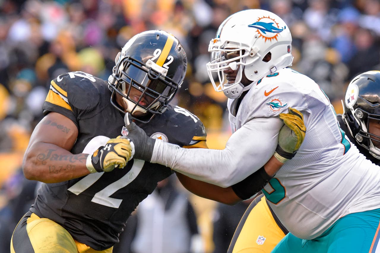 Pittsburgh Steelers outside linebacker James Harrison (92) works to get around Miami Dolphins offensive tackle Branden Albert (76) during the second half of an AFC Wild Card NFL football game in Pittsburgh, Sunday, Jan. 8, 2017. The Steelers won 30-12. (AP Photo/Don Wright)