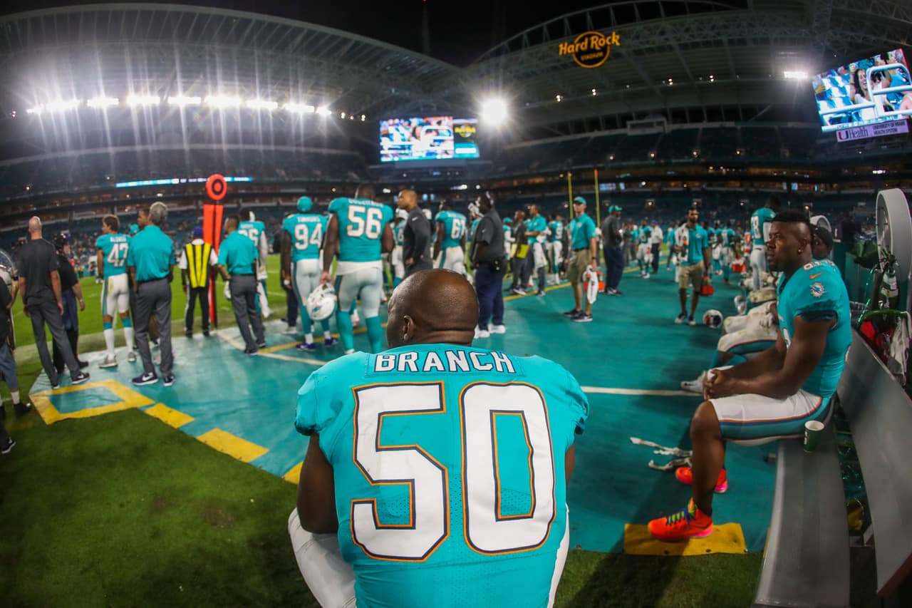 Miami Dolphins defensive end Andre Branch (50) looks on from the bench during a game against the Atlanta Falcons on Thursday, Aug. 10, 2017 in Miami Gardens, Fla. (Logan Bowles via AP)