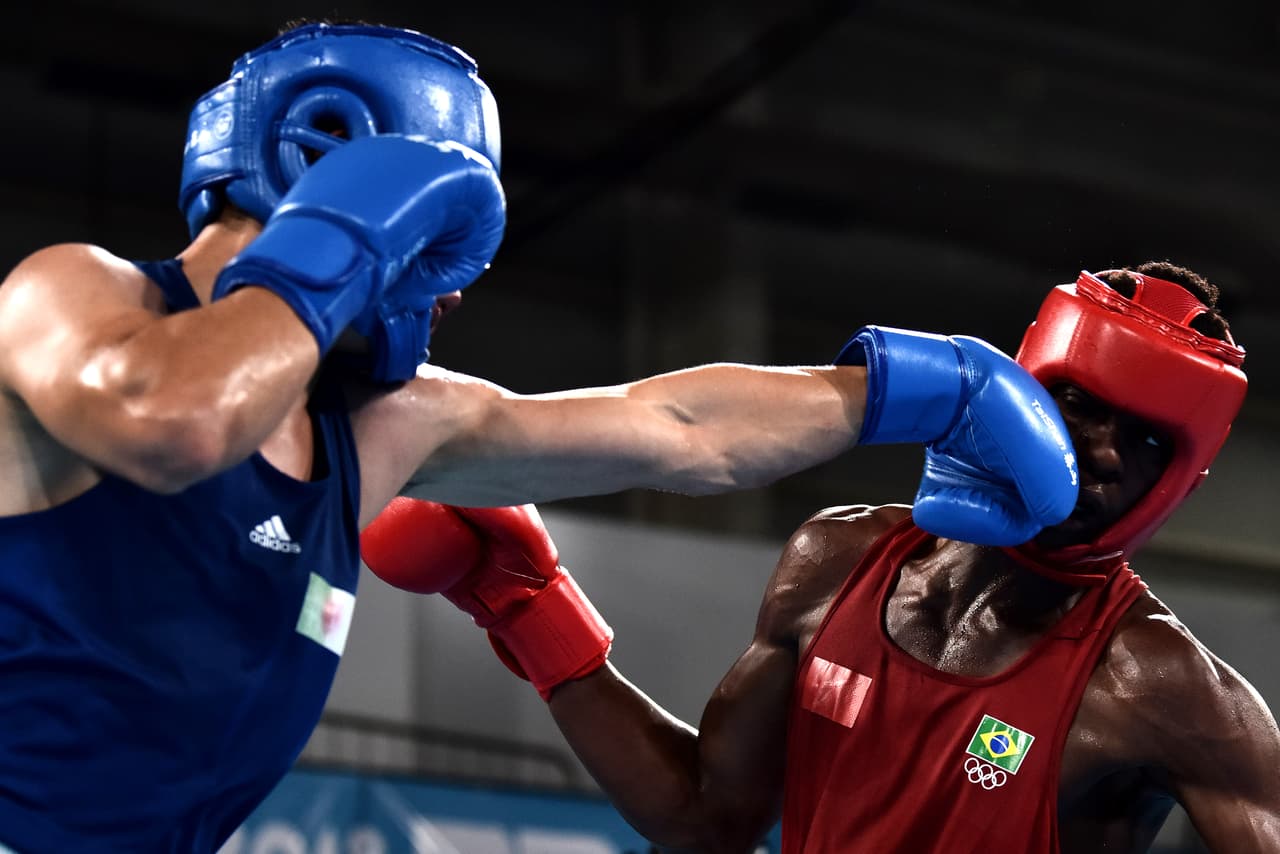 BUENOS AIRES, ARGENTINA - OCTOBER 17: Keno Machado of Brazil looks (red) fights against Farid Douibi (blue) of Algeria on during Men's Middle (75kg) Gold Medal Bout during day 11 of Buenos Aires 2018 youth Olympic Games at Oceania Pavilion in the Youth Olympic Park on October 17, 2018 in Buenos Aires, Argentina. (Photo by Amilcar Orfali/Getty Images)