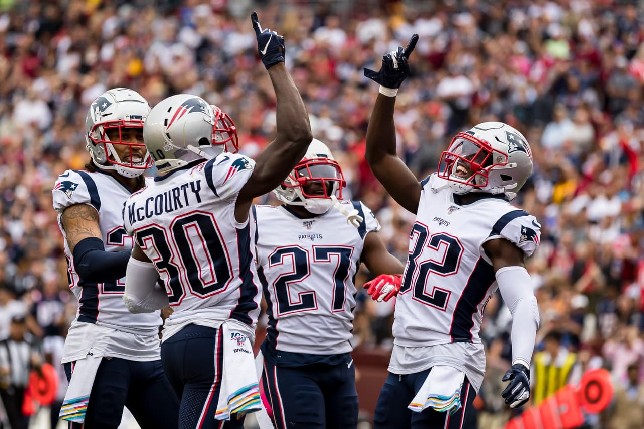 LANDOVER, MD - OCTOBER 06: Jason McCourty #30 of the New England Patriots celebrates with teammates after intercepting a pass during the first half against the Washington Redskins at FedExField on October 6, 2019 in Landover, Maryland. (Photo by Scott Taetsch/Getty Images)