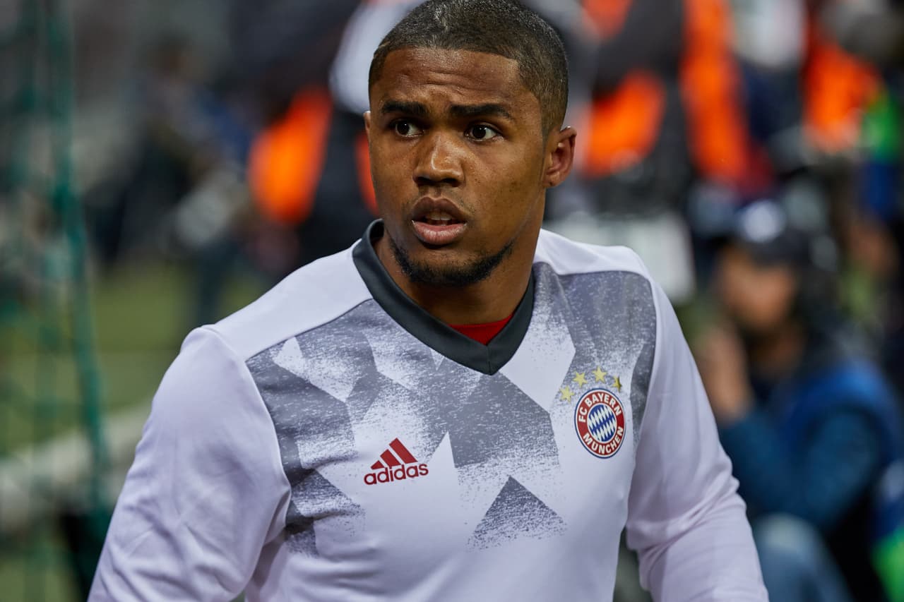 MUNICH, GERMANY - APRIL 12: Douglas Costa of Munich looks on during the UEFA Champions League Quarter Final first leg match between FC Bayern Muenchen and Real Madrid CF at Allianz Arena on April 12, 2017 in Munich, Germany. (Photo by TF-Images/Getty Images)