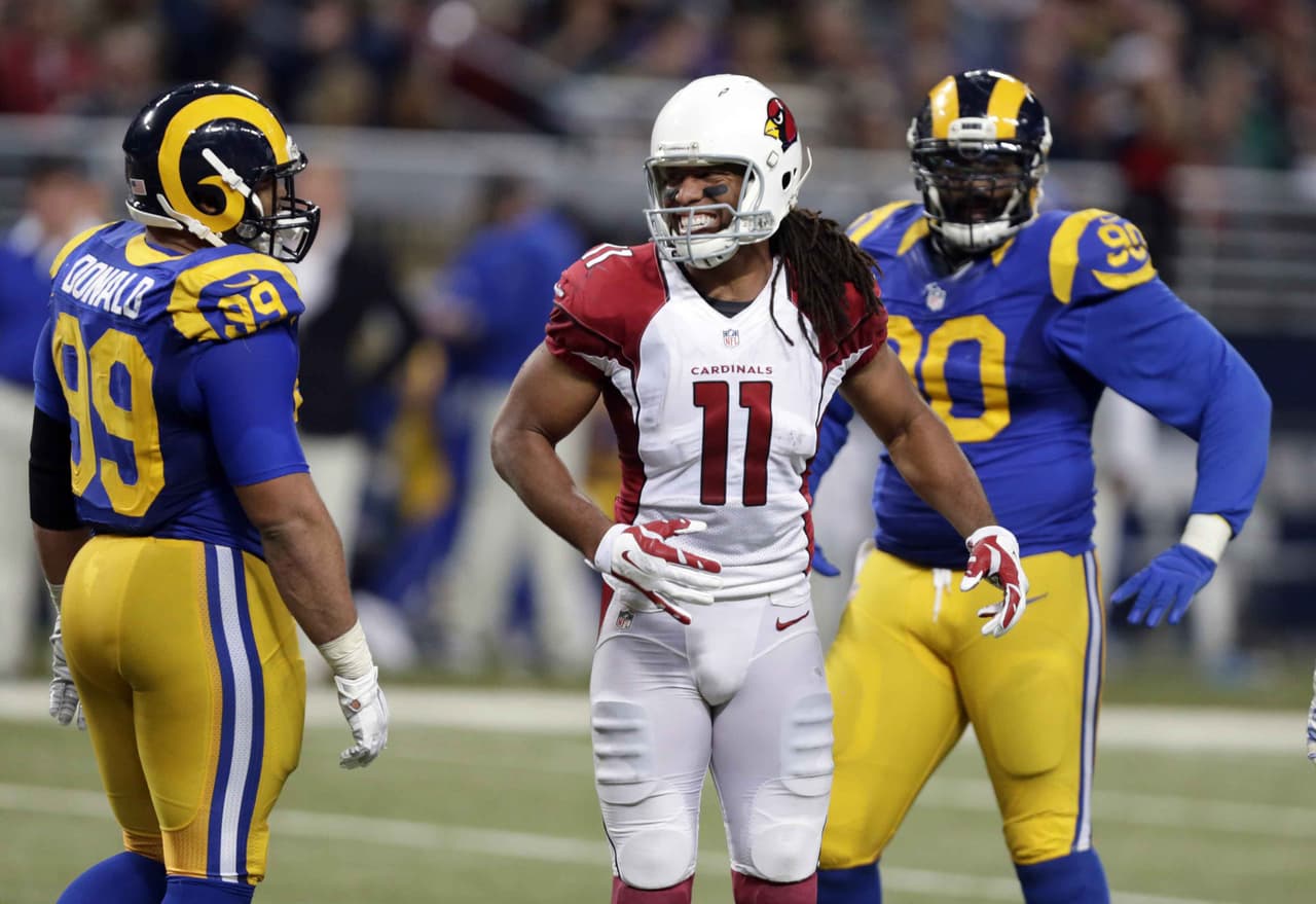 Larry Fitzgerald logró la recepción mil de su carrera y los Cardinals ligaron cinco triunfos al vencer como visitantes 27-3 a los Rams.
