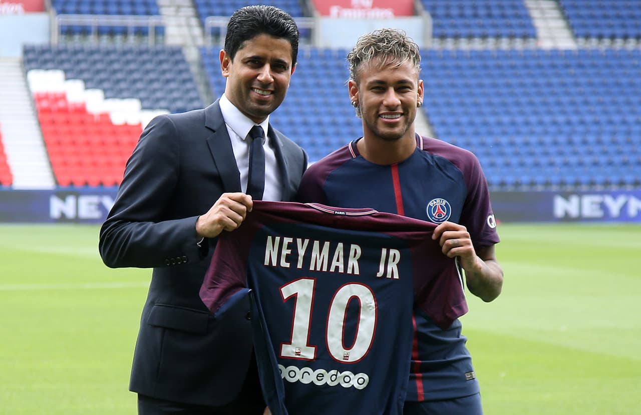 PARIS, FRANCE - AUGUST 4: Neymar Jr of Brazil - here with President of PSG Nasser Al-Khelaifi - during press conference and jersey presentation following his signing as new player of Paris Saint-Germain at Parc des Princes on August 4, 2017 in Paris, France. (Photo by Jean Catuffe/Getty Images)