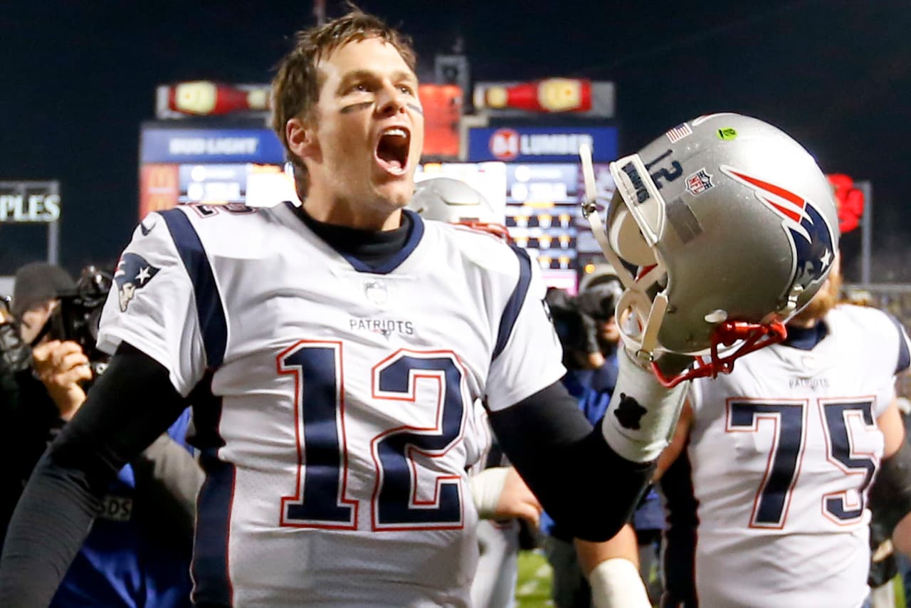 New England Patriots quarterback Tom Brady (12) celebrates with center Ted Karras (75) as they leave the field after defeating the Pittsburgh Steelers in an NFL football game , Sunday, Dec. 17, 2017, in Pittsburgh. The Patriots won 27-24. (AP Photo/Keith Srakocic)