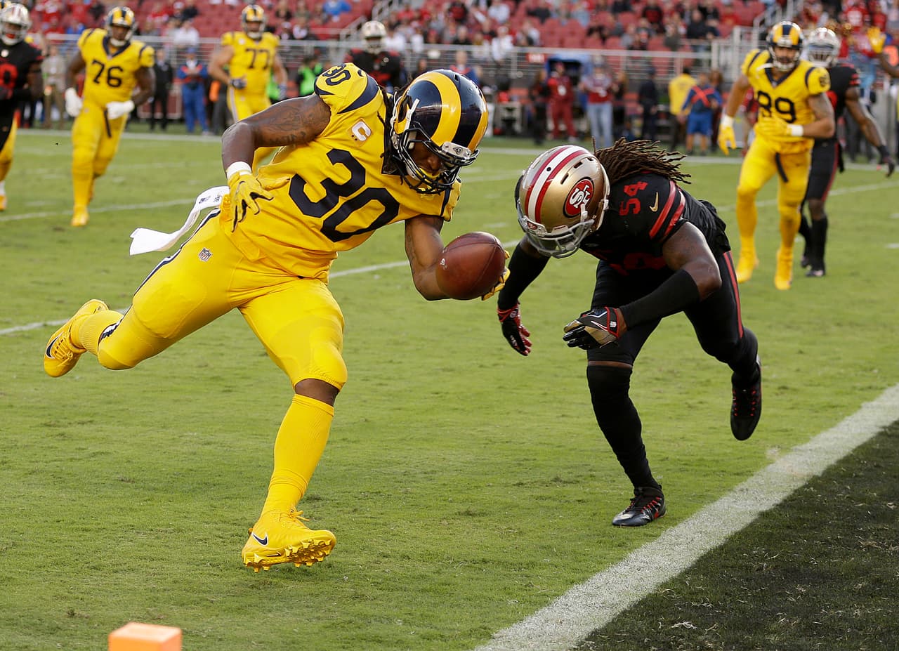 Los Angeles Rams running back Todd Gurley (30) scores a touchdown in front of San Francisco 49ers outside linebacker Ray-Ray Armstrong (54) during the first half of an NFL football game in Santa Clara, Calif., Thursday, Sept. 21, 2017. (AP Photo/Ben Margot)