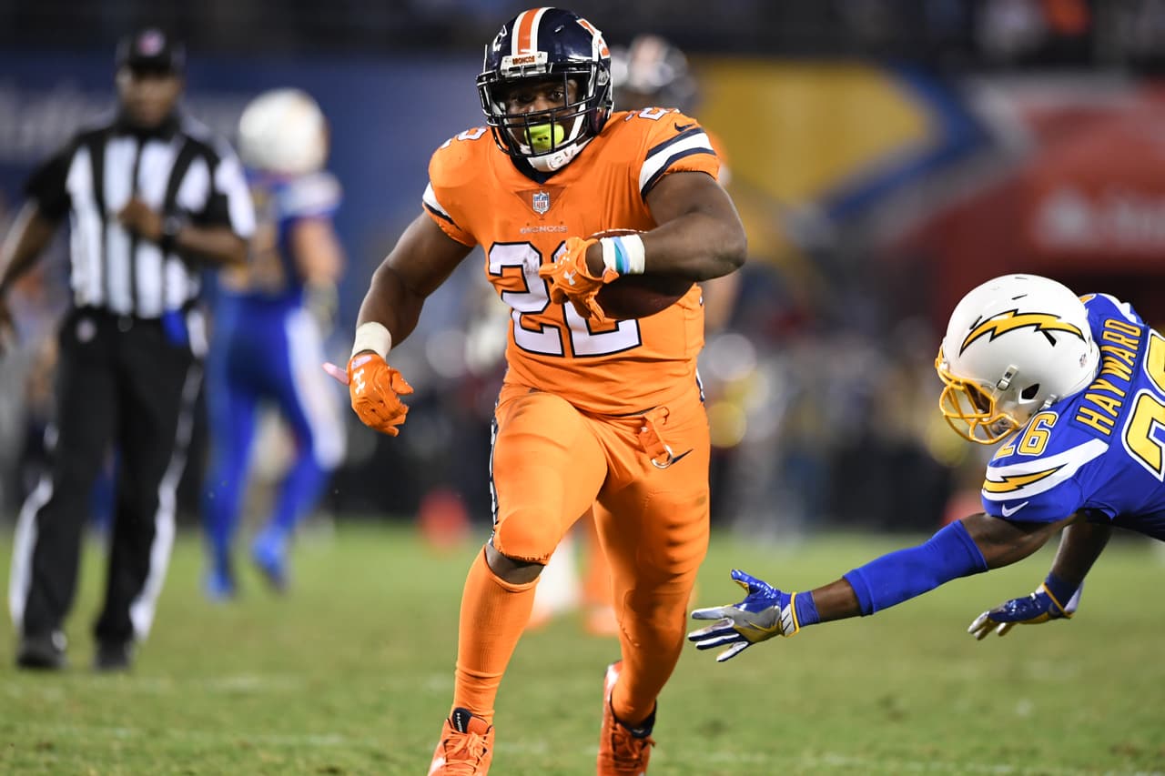 Denver Broncos running back C.J. Anderson (22) breaks open at midfield and carries for a 20 yard touchdown but the play was nullified by a holding penalty during fourth quarter action against the San Diego Chargers in the NFL game at Qualcomm Stadium in San Diego, Ca October 13, 2016. (Eric Bakke via AP)