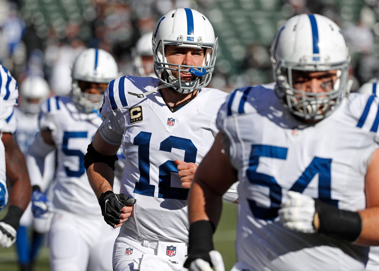 Indianapolis Colts quarterback Andrew Luck (12) takes the field during an NFL game by Oakland Raiders linebacker Khalil Mack (52) on Saturday, Dec. 24, 2016, in Oakland, Calif. The Raiders won the game, 33-25. (Greg Trott via AP)