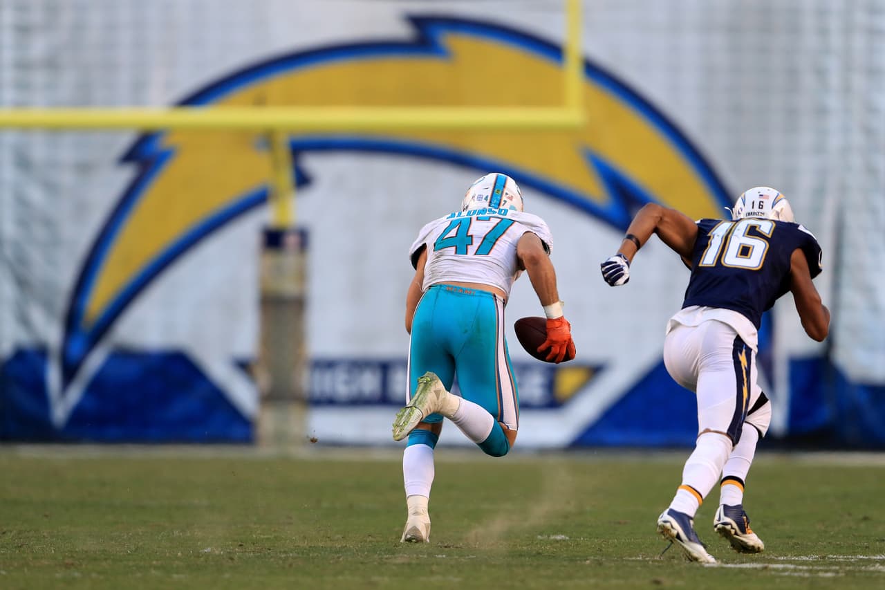 SAN DIEGO, CA - NOVEMBER 13: Kiko Alonso #47 of the Miami Dolphins intercepts and returns it for a touchdown as Tyrell Williams #16 of the San Diego Chargers chases during the second half of a game at Qualcomm Stadium on November 13, 2016 in San Diego, California. (Photo by Sean M. Haffey/Getty Images)