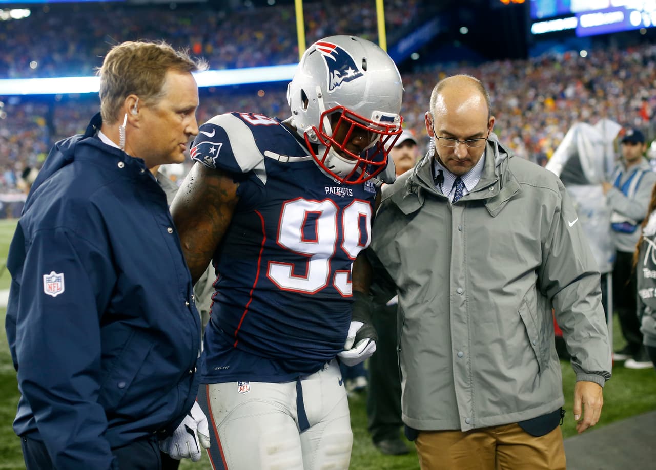 New England Patriots defensive end Dominique Easley (99) is assisted to the locker room after an injury in the first half of an NFL football game against the Pittsburgh Steelers, Thursday, Sept. 10, 2015, in Foxborough, Mass. (AP Photo/Winslow Townson)