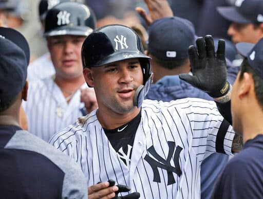 New York Yankees' Gary Sanchez celebrates with teammates after hitting a three-run homer during the first inning of a baseball game against the Tampa Bay Rays at Yankee Stadium, Wednesday, June 19, 2019, in New York. (AP Photo/Seth Wenig)