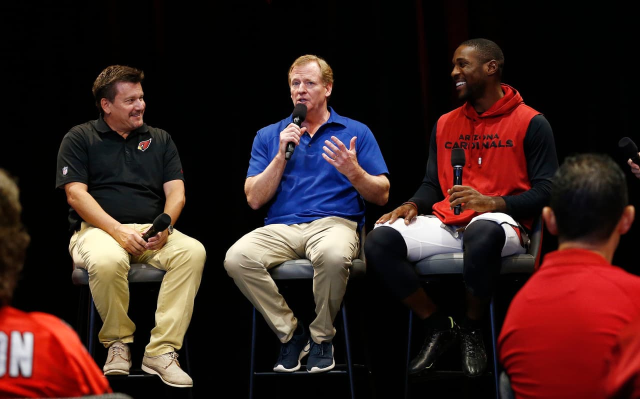 Arizona Cardinals team president Michael Bidwill, left, is joined by NFL football Commissioner Roger Goodell, center, and Cardinals cornerback Patrick Peterson, right, as they speak with Cardinals season ticket holders University of Phoenix Stadium, Monday, Aug. 14, 2017, in Glendale, Ariz. (AP Photo/Ross D. Franklin)