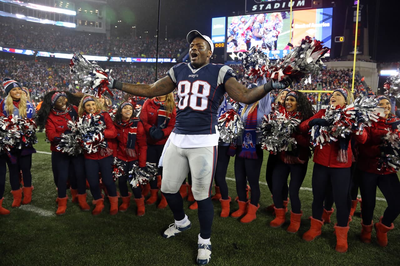 New England Patriots Martellus Bennett (88) celebrates with the Patriots cheerleaders after the AFC championship NFL football game against the Pittsburgh Steelers, Sunday, Jan. 22, 2017, in Foxborough, Mass. (Tom DiPace via AP)