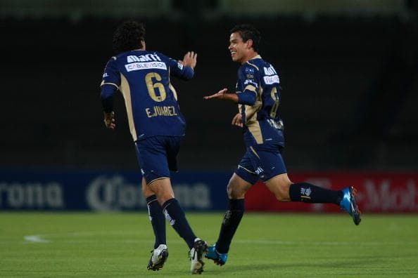MEXICO CITY, MEXICO - MARCH 18: Puma's players Efrain Juarez (L) and Pablo Barrera (R) celebrate a scored goal against Marathon during their match as part of the 2010 Concacaf champions league at the Olympic Stadium on March 18, 2010 in Mexico City, Mexico. (Photo by Francisco Estrada/LatinContent/Getty Images)