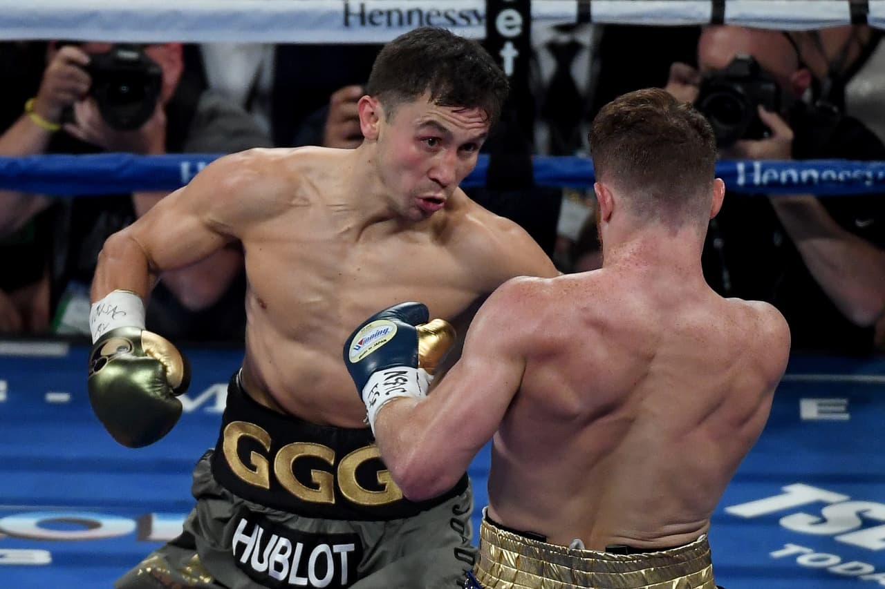 LAS VEGAS, NV - SEPTEMBER 16: (L-R) Gennady Golovkin throws a punch at Canelo Alvarez during their WBC, WBA and IBF middleweight championionship bout at T-Mobile Arena on September 16, 2017 in Las Vegas, Nevada. (Photo by Ethan Miller/Getty Images)