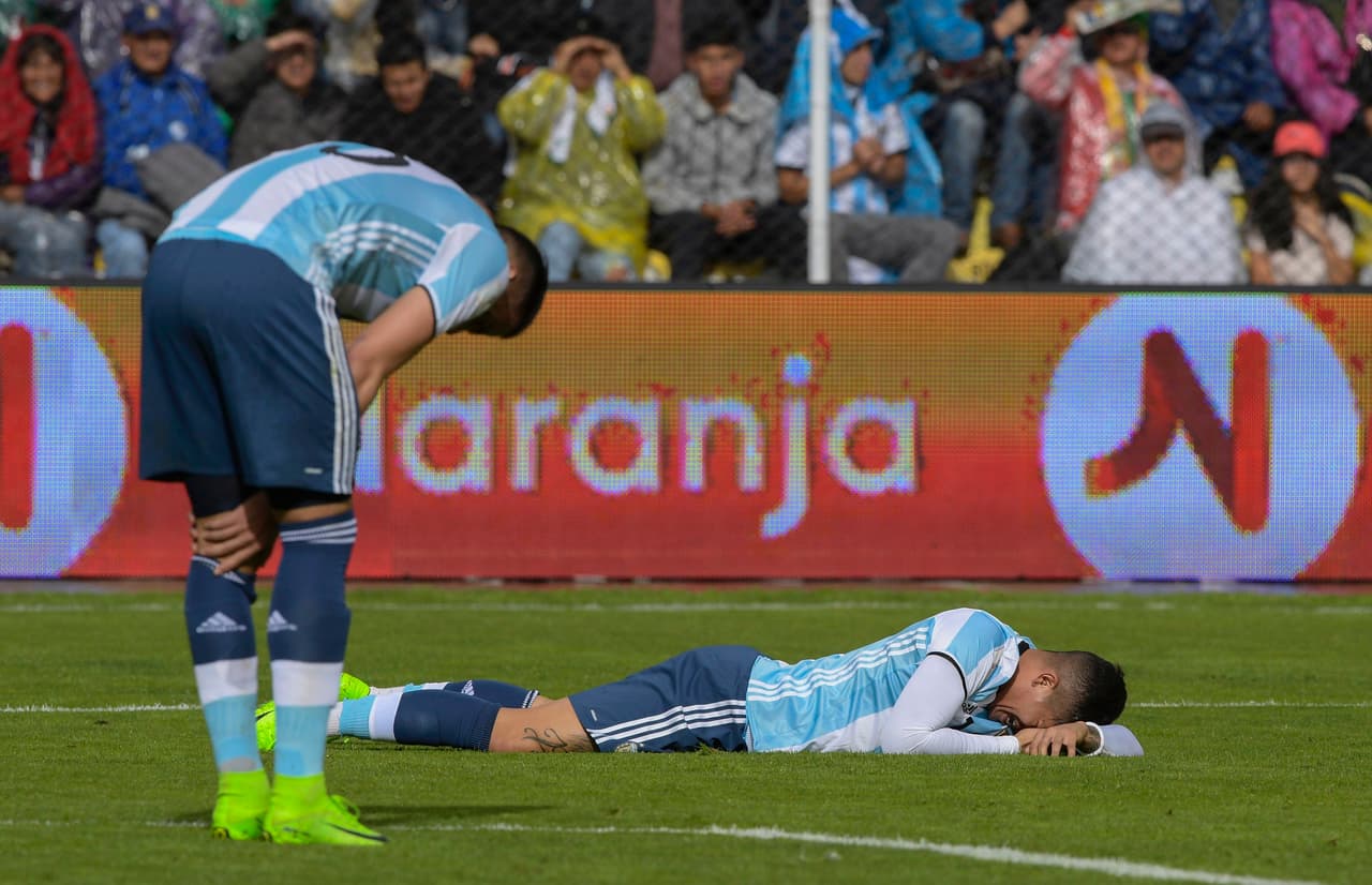 Argentina's Marcos Rojo (R) and Mateo Musacchio react during their 2018 FIFA World Cup qualifier football match in La Paz, on March 28, 2017. / AFP PHOTO / JUAN MABROMATA (Photo credit should read JUAN MABROMATA/AFP/Getty Images)