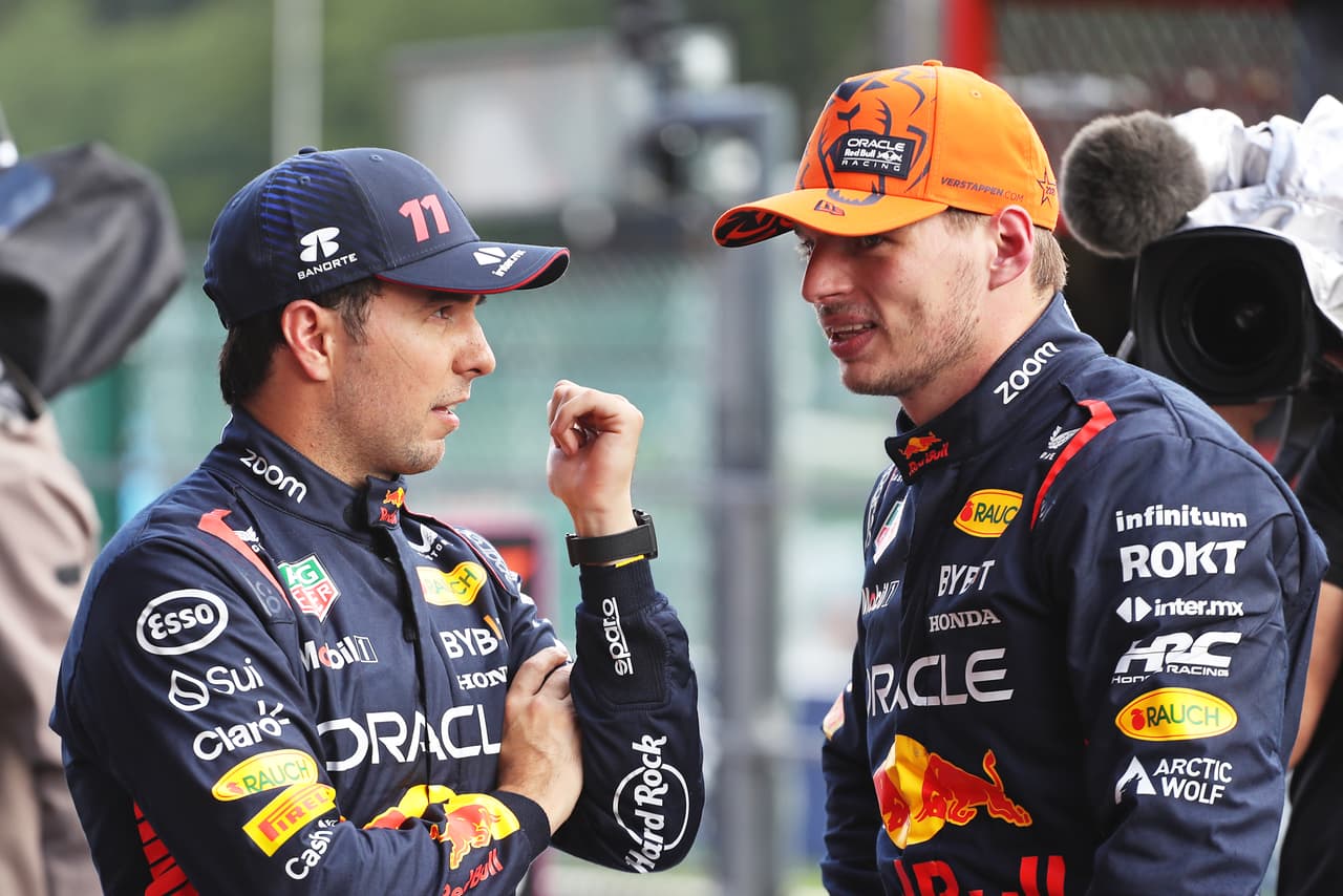 SPA, BELGIUM - JULY 28: Pole position qualifier Max Verstappen of the Netherlands and Oracle Red Bull Racing and Third placed qualifier Sergio Perez of Mexico and Oracle Red Bull Racing talk in parc ferme during qualifying ahead of the F1 Grand Prix of Belgium at Circuit de Spa-Francorchamps on July 28, 2023 in Spa, Belgium. (Photo by Peter Fox/Getty Images)
