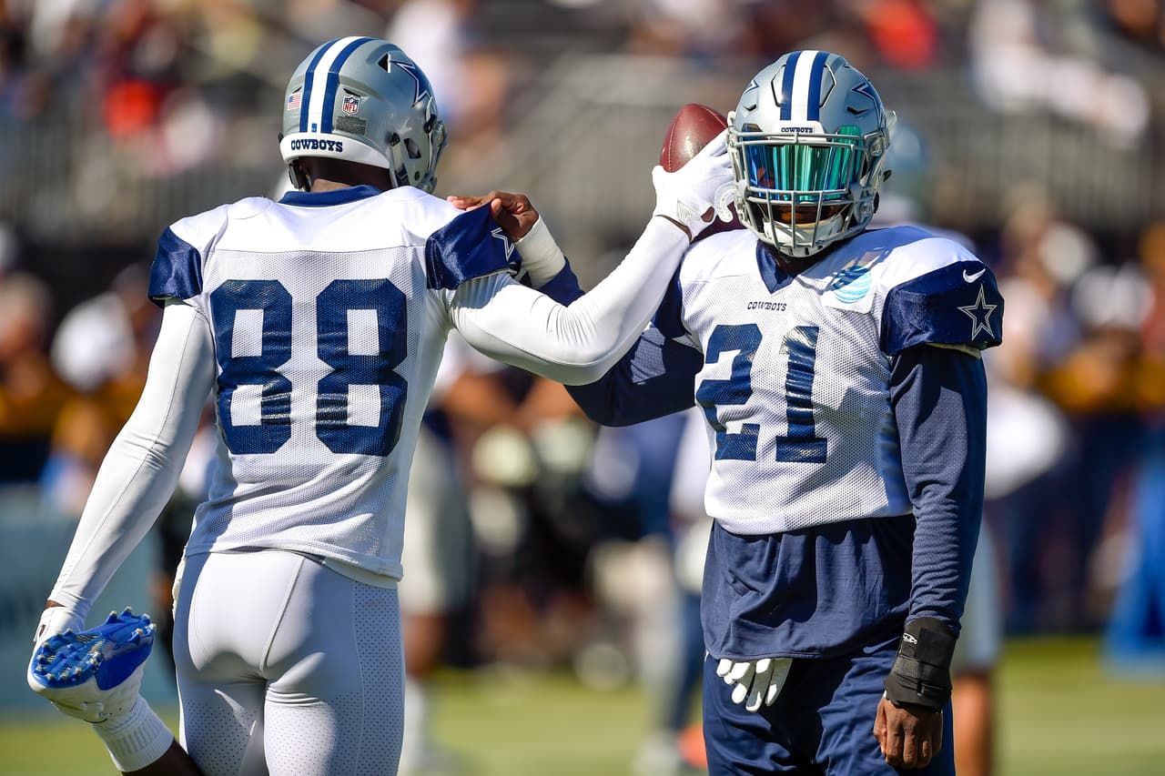 Dallas Cowboys wide receiver Dez Bryant (88) and running back Ezekiel Elliott (21) stretch-out during NFL football training camp in Oxnard, Calif., Wednesday, July 26, 2017. (AP Photo/Gus Ruelas)