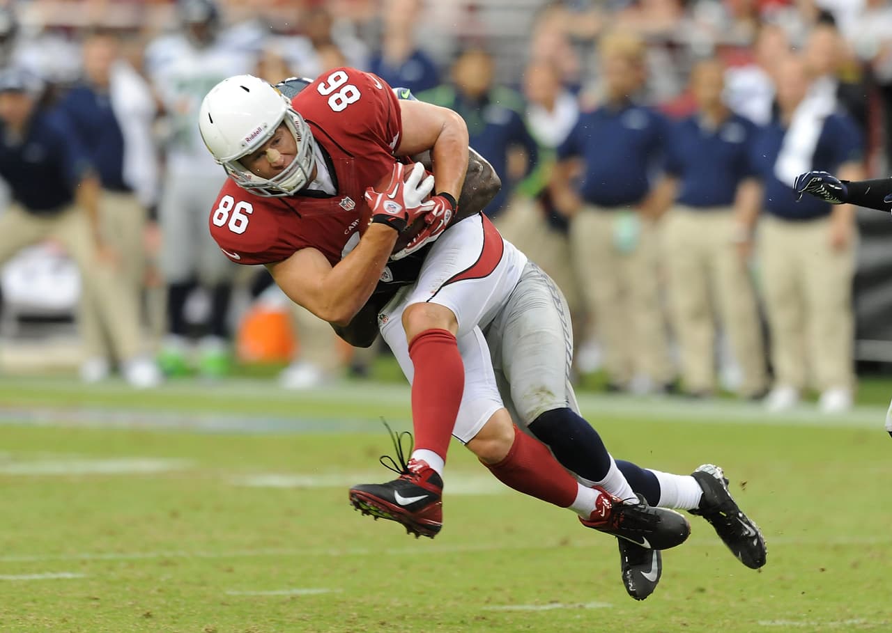 GLENDALE, AZ - SEPTEMBER 09: Todd Heap #86 of the Arizona Cardinals is takled after making a catch against the Seattle Seahawks at University of Phoenix Stadium on September 9, 2012 in Glendale, Arizona. (Photo by Norm Hall/Getty Images)
