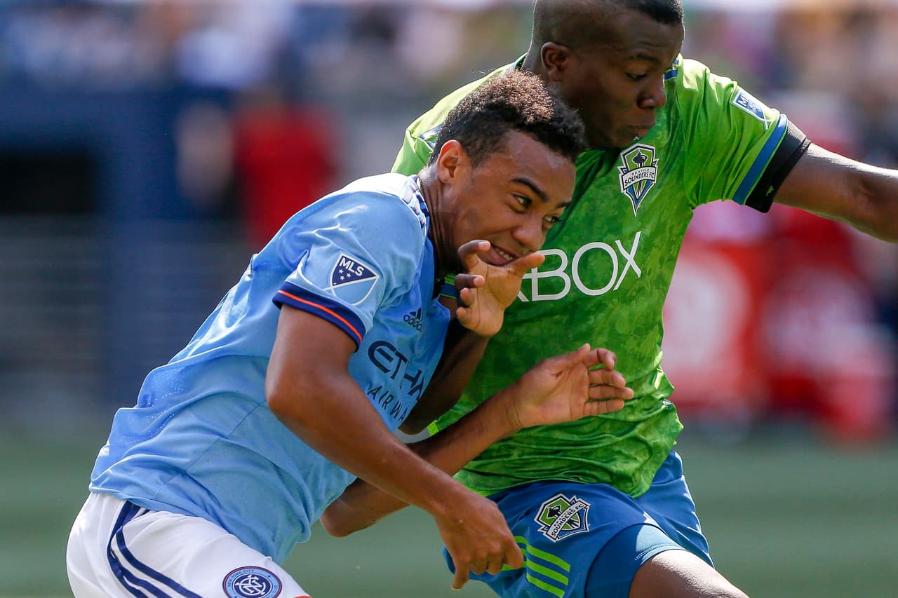 Jul 29, 2018; Seattle, WA, USA; Seattle Sounders FC defender Nouhou (5) blocks out New York City FC forward Jonathan Lewis (17) during the second half at CenturyLink Field. Mandatory Credit: Jennifer Buchanan-USA TODAY Sports