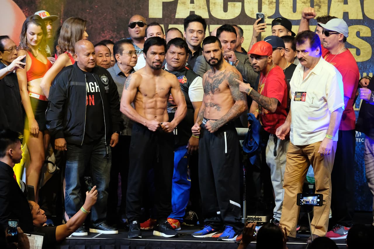 KUALA LUMPUR, MALAYSIA - JULY 14: Manny Pacquiao of the Philippines and Lucas Matthysse of Argentina pose during weigh-in for their fight July 14, 2018 in Kuala Lumpur, Malaysia. (Photo by How Foo Yeen/Getty Images)