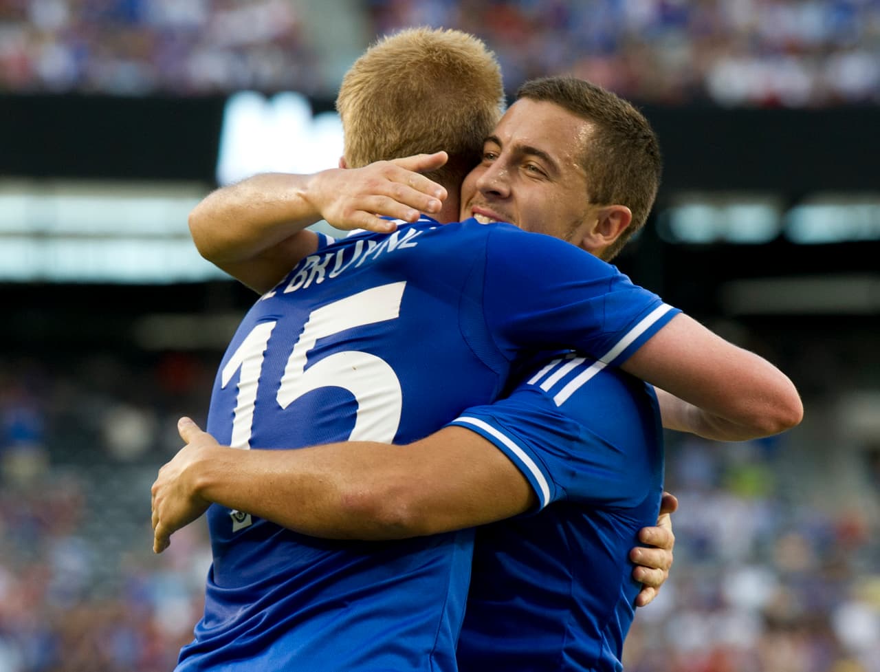Chelsea's Kevin De Bruyne gets a hug from teammate Eden Hazard as they celebrate his goal against AC Milan during a 2013 International Champions Cup match on August 4 , 2013 at the MetLife stadium in East Rutherford, New Jersey. AFP PHOTO/Don Emmert (Photo credit should read DON EMMERT/AFP/Getty Images)