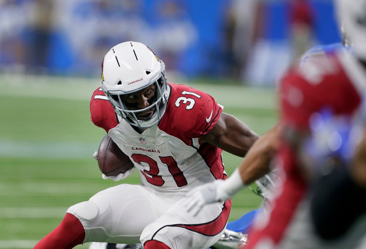 Arizona Cardinals running back David Johnson (31) looks for running room against the Detroit Lions during the first half of an NFL football game in Detroit, Sunday, Sept. 10, 2017. (AP Photo/Duane Burleson)