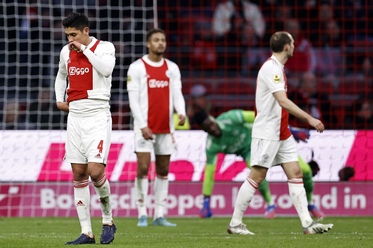 Ajax' Mexican midfielder Edson Alvarez (L) and teammates react after Waalwijk scored the equalizer during the Dutch Eredivisie football match between Ajax Amsterdam and RKC Waalwijk at the Johan Cruijff ArenA in Amsterdam on January 10, 2021. - - Netherlands OUT (Photo by MAURICE VAN STEEN / ANP / AFP) / Netherlands OUT (Photo by MAURICE VAN STEEN/ANP/AFP via Getty Images)