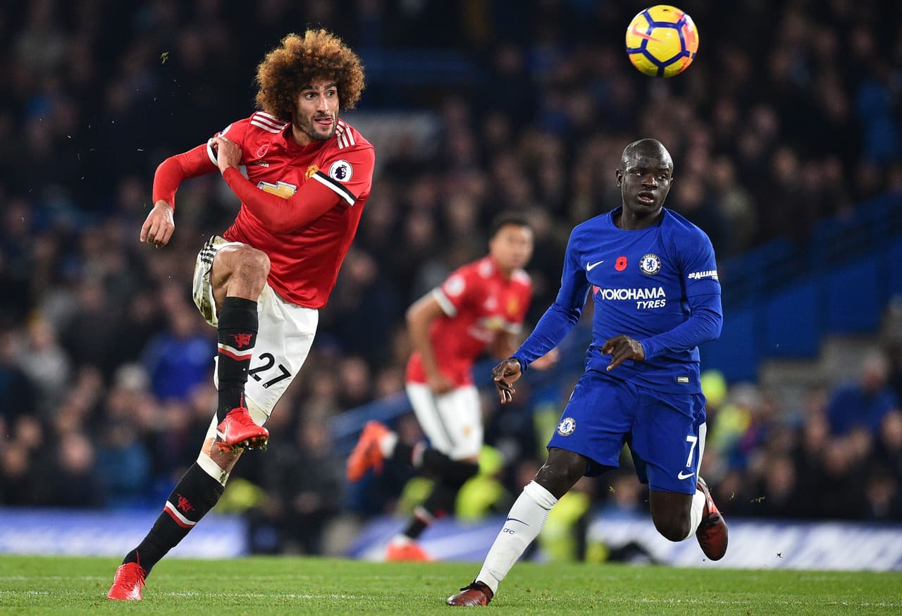 Manchester United's Belgian midfielder Marouane Fellaini (L) has an unsuccessful attempt on goal during the English Premier League football match between Chelsea and Manchester United at Stamford Bridge in London on November 5, 2017. / AFP PHOTO / Glyn KIRK / RESTRICTED TO EDITORIAL USE. No use with unauthorized audio, video, data, fixture lists, club/league logos or 'live' services. Online in-match use limited to 75 images, no video emulation. No use in betting, games or single club/league/player publications. / (Photo credit should read GLYN KIRK/AFP/Getty Images)