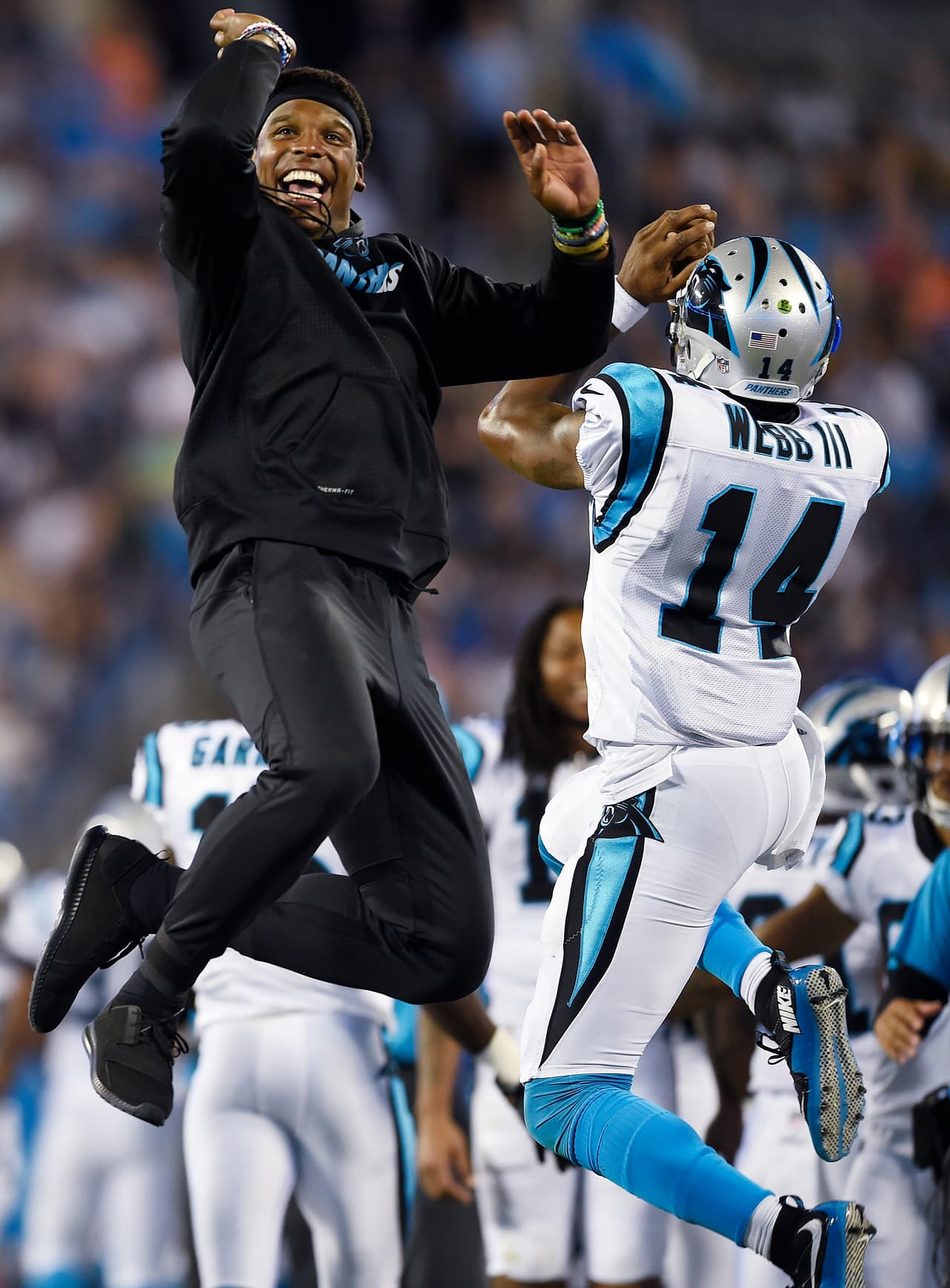 Carolina Panthers quarterback Cam Newton celebrates a Panthers Damiere Byrd touchdown with Carolina Panthers quarterback Joe Webb (14) during the second half of an NFL preseason football game against the Houston Texans, Wednesday, Aug. 9, 2017, in Charlotte, N.C. (AP Photo/Mike McCarn)