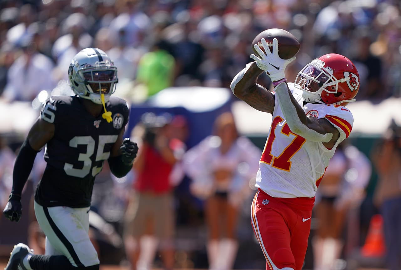 OAKLAND, CA - SEPTEMBER 15: Mecole Hardman #17 of the Kansas City Chiefs catches a touchdown pass over Curtis Riley #35 of the Oakland Raiders during the second quarter of an NFL football game at RingCentral Coliseum on September 15, 2019 in Oakland, California. (Photo by Thearon W. Henderson/Getty Images)