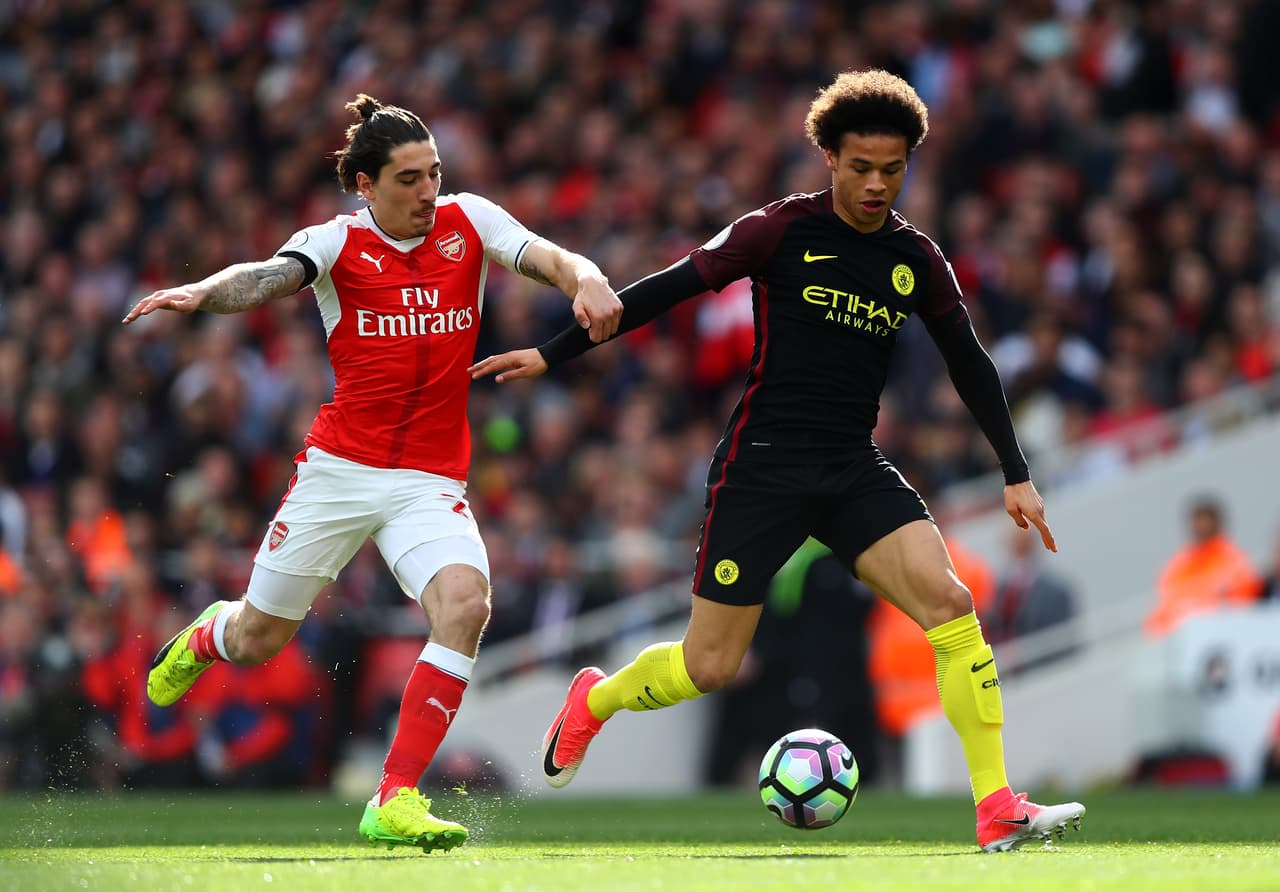LONDON, ENGLAND - APRIL 02: Hector Bellerin of Arsenal (L) and Leroy Sane of Manchester City (R) battle for possession during the Premier League match between Arsenal and Manchester City at Emirates Stadium on April 2, 2017 in London, England. (Photo by Clive Rose/Getty Images)