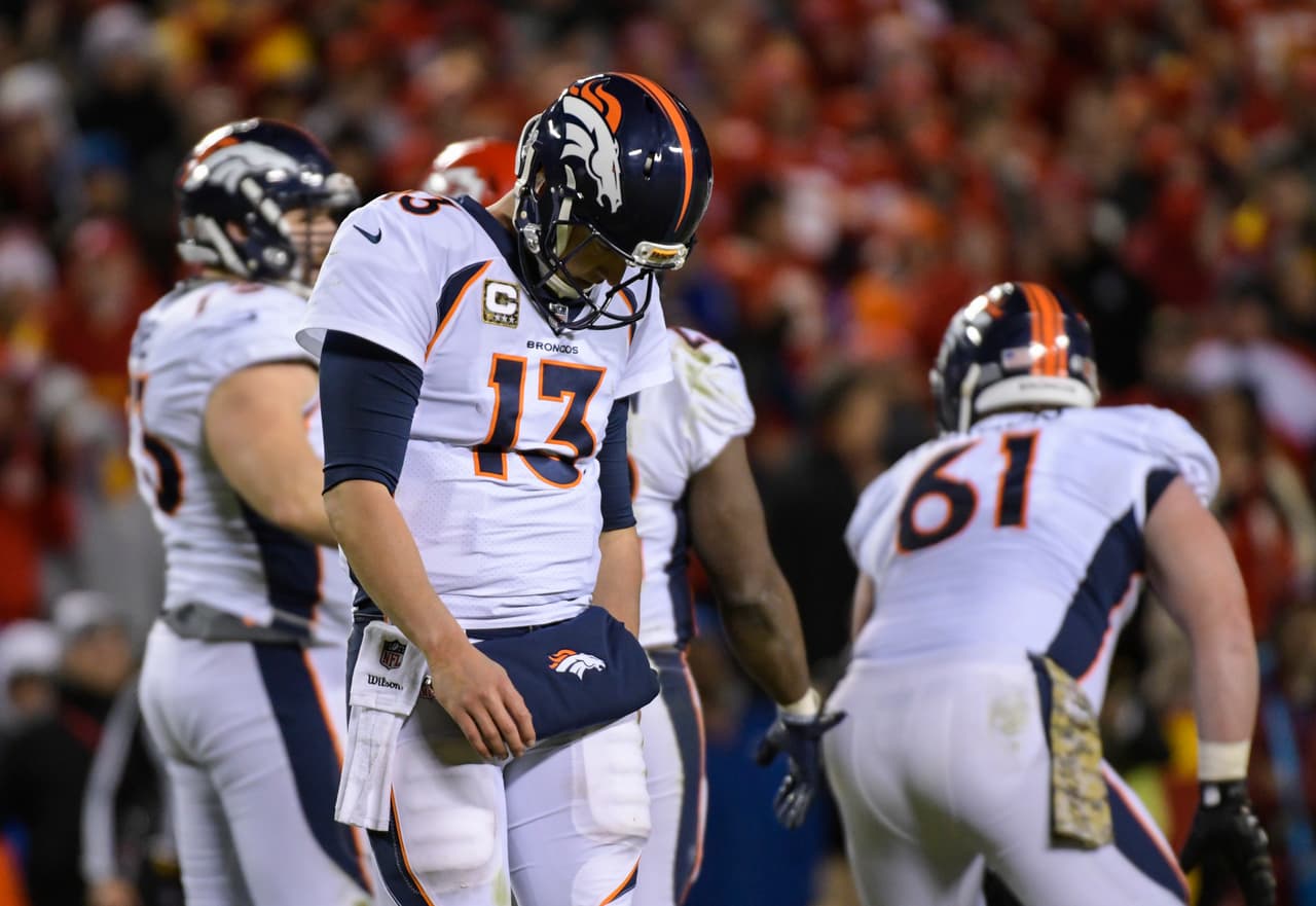 Denver Broncos quarterback Trevor Siemian (13) walks to the sidelines after calling a time-out during the second half of an NFL football game in Kansas City, Mo., Monday, October 30, 2017. (AP Photo/Reed Hoffmann)