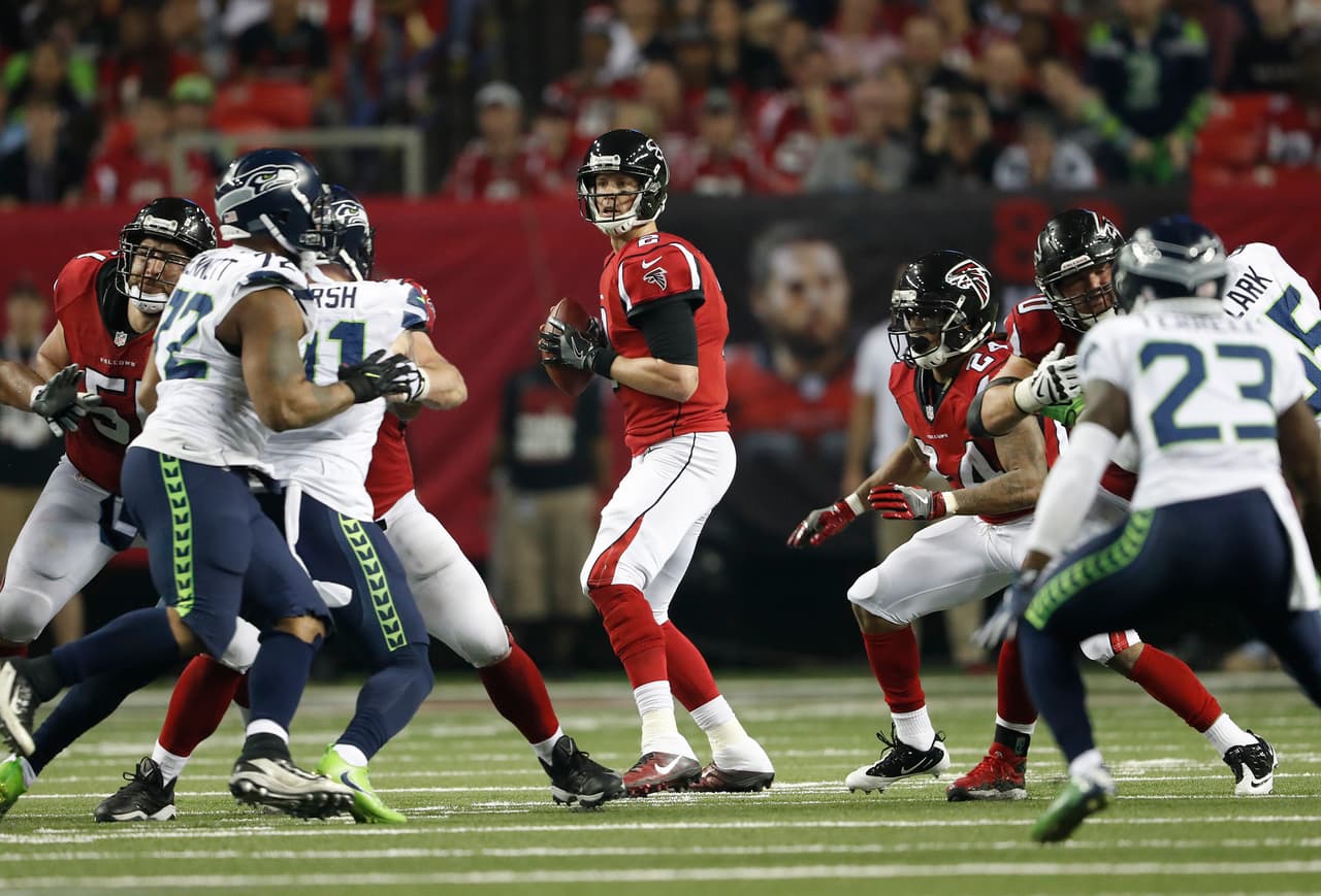 Atlanta Falcons quarterback Matt Ryan (2) works against the Seattle Seahawks during the second half of an NFL football divisional football game, Saturday, Jan. 14, 2017, in Atlanta. (AP Photo/John Bazemore)