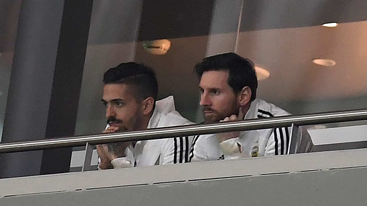 Argentina's forward Lionel Messi (R) attends a friendly football match between Spain and Argentina at the Wanda Metropolitano Stadium in Madrid on March 27, 2018. Messi was left out of Argentina's squad. He had been feeling pain in his hamstring and despite coach Jorge Sampaoli insisting the striker was fit, he did not even make the bench at the Wanda Metropolitano in Madrid. / AFP PHOTO / GABRIEL BOUYS (Photo credit should read GABRIEL BOUYS/AFP/Getty Images)