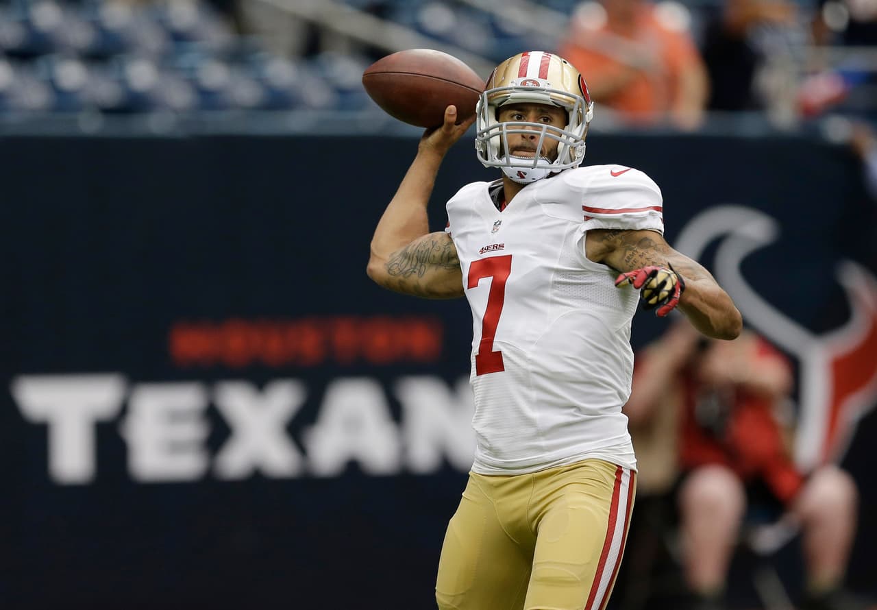 San Francisco 49ers' Colin Kaepernick throws before an NFL football preseason game against the Houston Texans, Thursday, Aug. 28, 2014, in Houston. (AP Photo/David J. Phillip)
